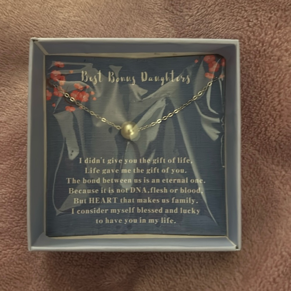 Touching “Bonus Daughter” pearl necklace keepsake.